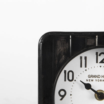 Karl 6.0L x 3.0W x 6.8H Rustic Black Iron Rounded Square Table Clock