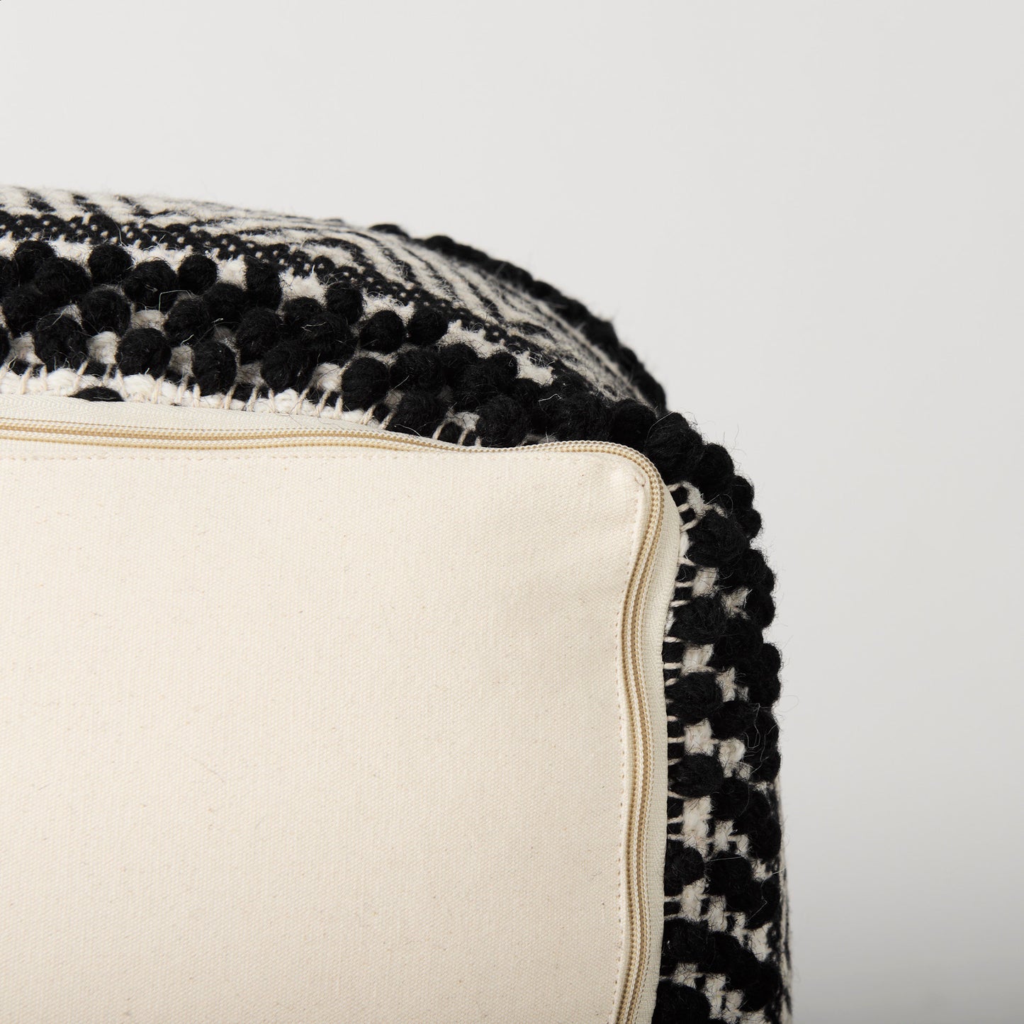 Garima 22.0L x 22.0W x 14.0H Black/White Wool and Cotton Patterned Pouf